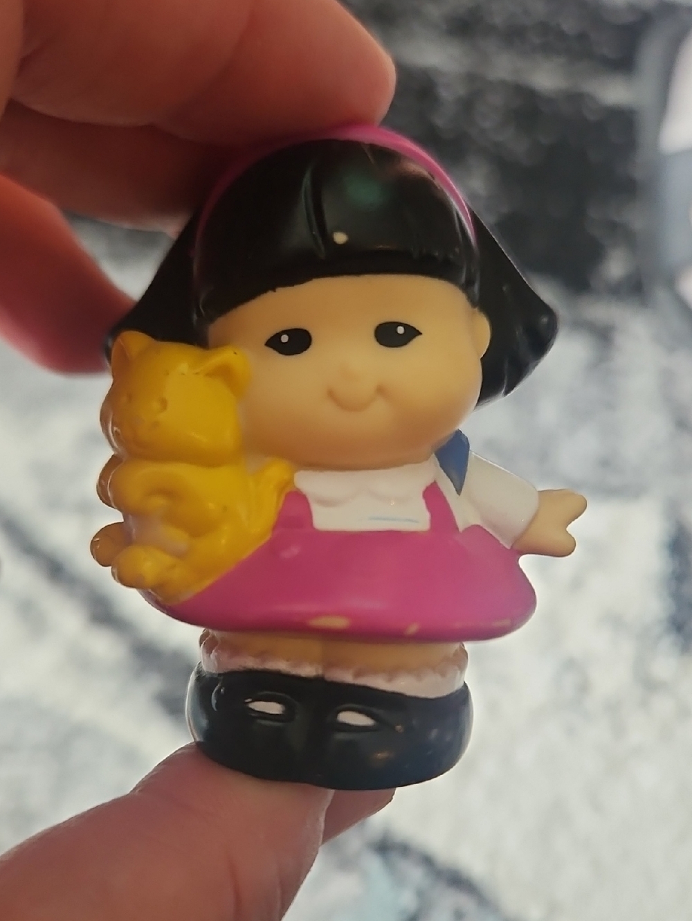 Fisher-Price Little People Sonya Lee figure wearing a pink dress